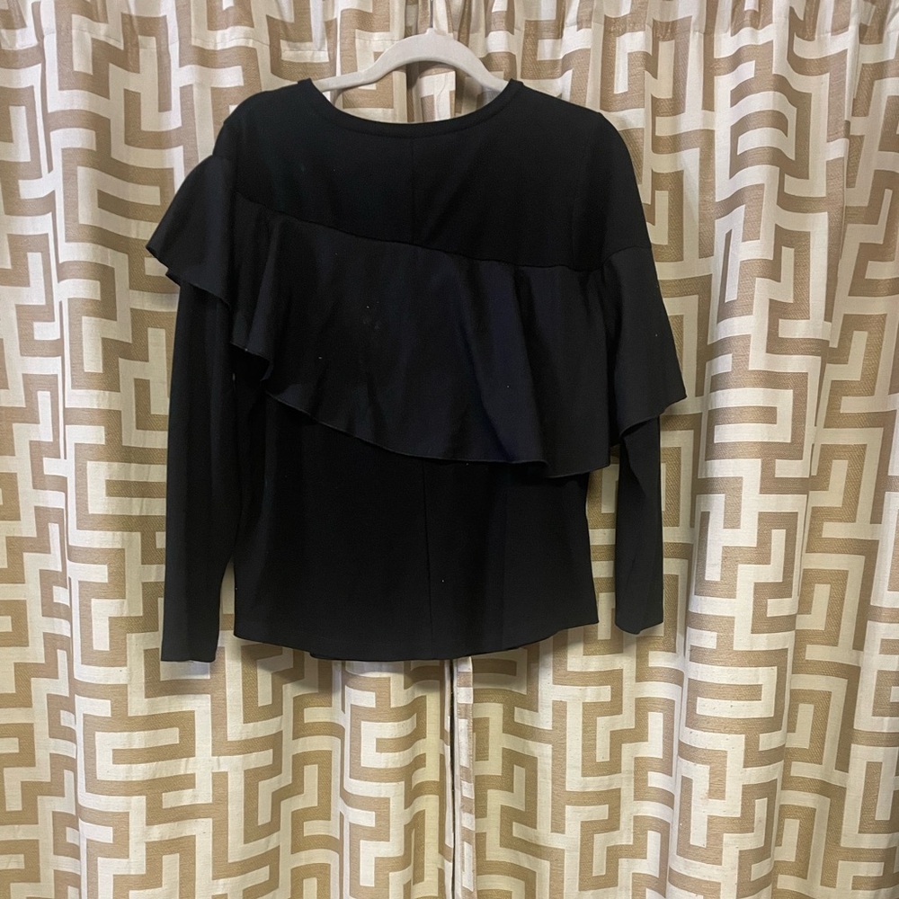 Black ruffled long sleeve shirt.